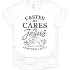 A white short-sleeve crewneck t-shirt with a dark brown graphic print on the front. The graphic features the text 'CASTED MY CARES ON Jesus AND NOW I REST' in a mix of serif and cursive fonts, accompanied by a simple line drawing of a baby panda resting on a rock with leaves.