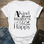 White t-shirt with 'A Kind Word makes A Person Happy' Proverbs 12:25 text with a smile. Christian elegant typography faith apparel conversation starter
on a wooden surface with jeans and a Bible.