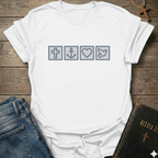 White t-shirt with Biblical Relatable Symbols Christian T-Shirt faith apparel conversation starter on a wooden surface with jeans and a Bible.