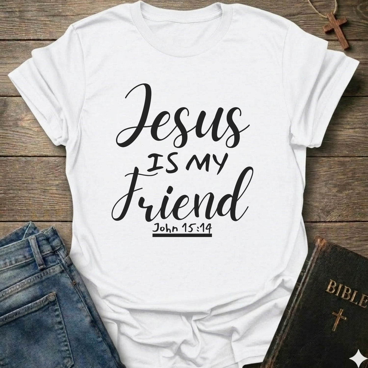 White t-shirt with 'Jesus is my friend' text on a wooden surface with jeans and a Bible. Jesus is My Friend Christian T-Shirt John 15:14 bold faith apparel Faith Forward