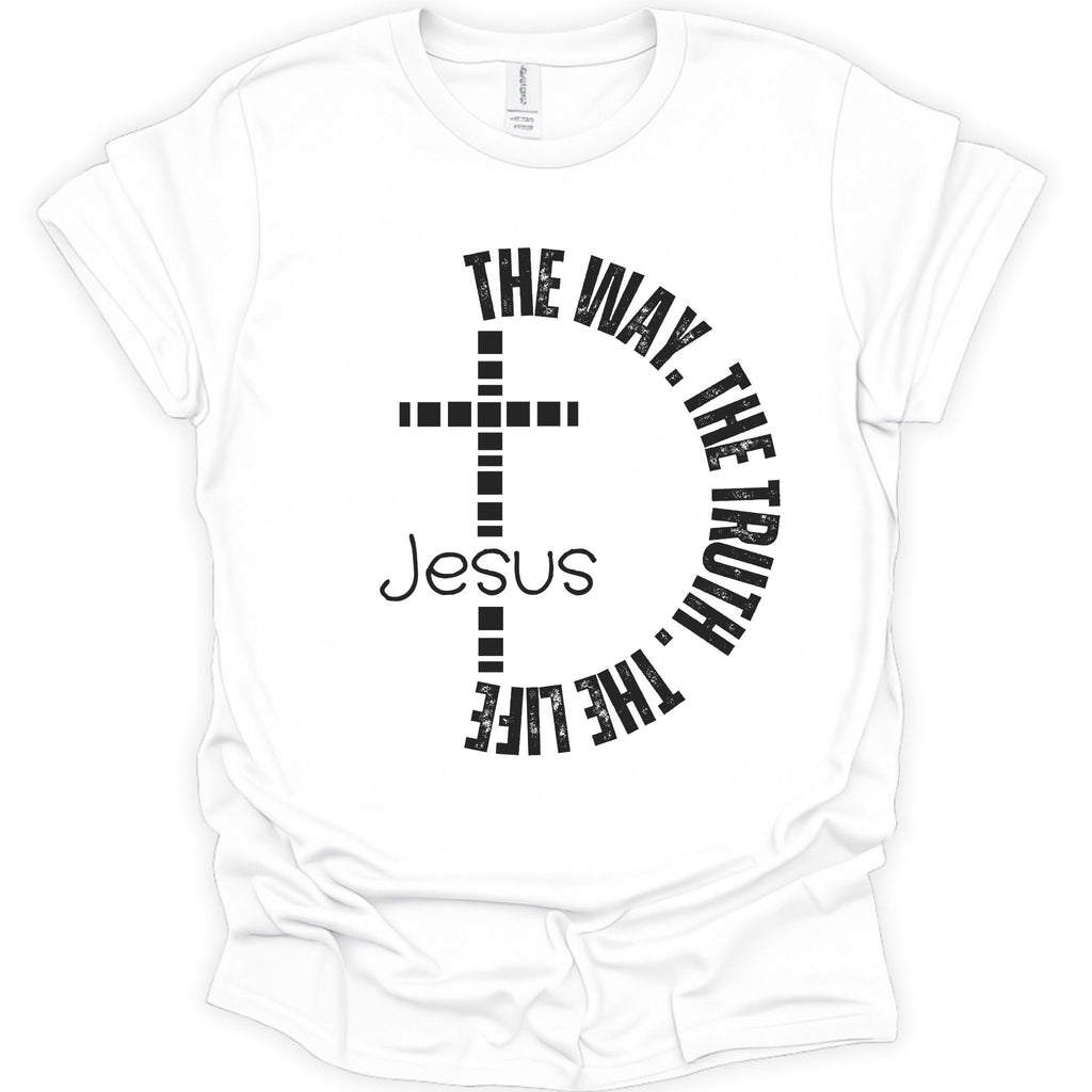 A white short-sleeve crewneck t-shirt with a black graphic print on the front. The design features a cross with the word 'Jesus' written in a script font, surrounded by the text 'THE WAY, THE TRUTH, THE LIFE' in a circular arc.