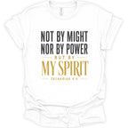 A white short-sleeve crewneck t-shirt with a printed inspirational quote on the front reading 'NOT BY MIGHT NOR BY POWER BUT BY MY SPIRIT ZECHARIAH 4:6' in black and gold lettering.