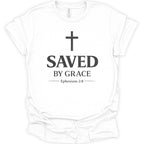 A white short-sleeve crewneck t-shirt with a black graphic print on the front featuring a cross, the text 'SAVED BY GRACE', and 'Ephesians 2:8'.
