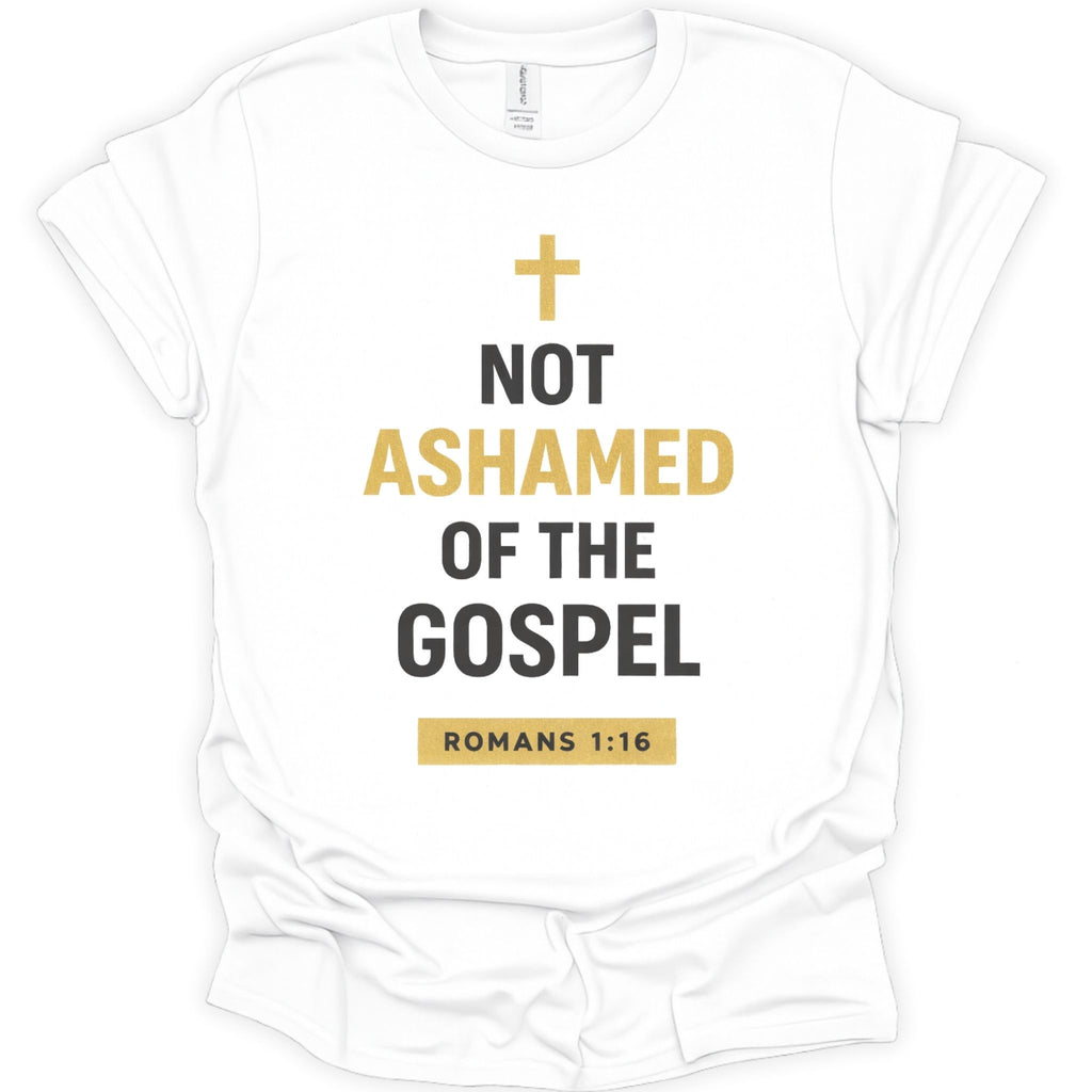 A white short-sleeve crewneck t-shirt with a graphic print on the front. The print features a gold cross above the text 'NOT ASHAMED OF THE GOSPEL' in black and gold lettering, with 'ROMANS 1:16' printed in a gold box at the bottom.