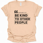 A natural-colored short-sleeve t-shirt with a black graphic print on the front reading 'EPHESIANS 4:32 BE KIND TO OTHER PEOPLE' inside a block layout, shown on a clean white background.