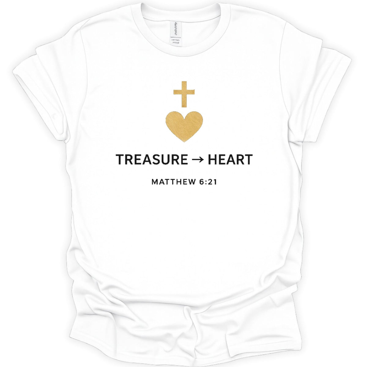 A white short-sleeve crewneck t-shirt with a gold heart and cross graphic above the text 'TREASURE -> HEART' and 'MATTHEW 6:21' printed in black.