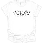 A white short-sleeve crewneck t-shirt with 'VICTORY 2 CORINTHIANS 2:14' printed in black across the chest, displayed on a clean white background.