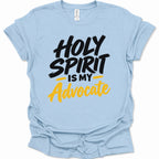 A light blue short-sleeve t-shirt with a graphic print that reads 'HOLY SPIRIT IS MY Advocate' in black and yellow lettering, displayed on a clean white background.