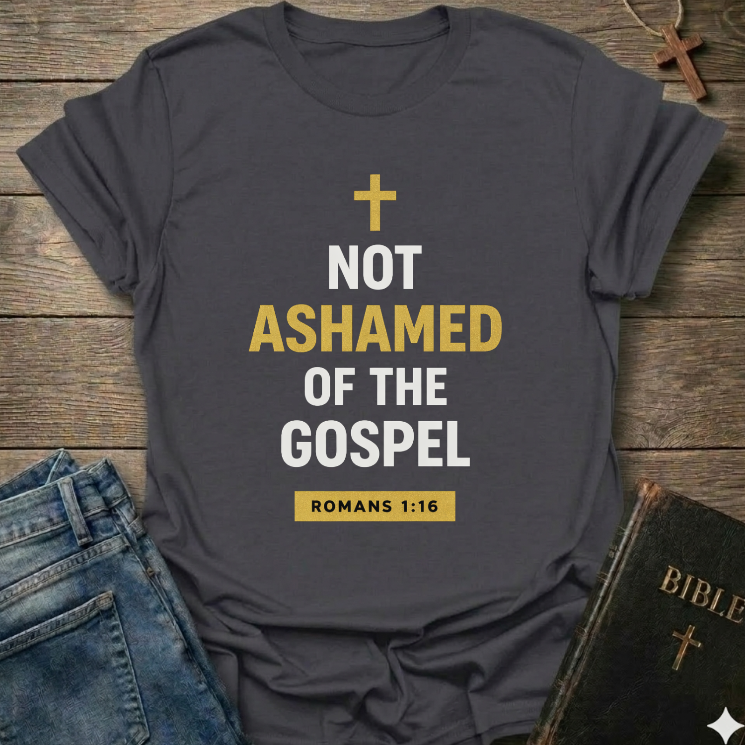 Gray t-shirt t-shirt with 'Not Ashamed of the Gospel' text on a wooden surface with a Bible and cross. Christian T-Shirt Romans 1:16 bold faith apparel Faith Forward