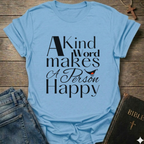 Light blue t-shirt with 'A Kind Word makes A Person Happy' Proverbs 12:25 text with a smile. Christian elegant typography faith apparel conversation starter
on a wooden surface with jeans and a Bible.