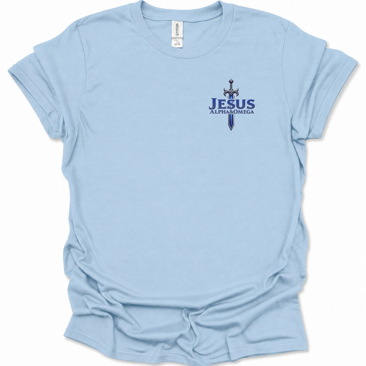 A light blue short-sleeve t-shirt with a small graphic on the left chest featuring a sword and the text  'JESUS ALPHA & OMEGA' in dark blue. The shirt is shown flat against a white background.