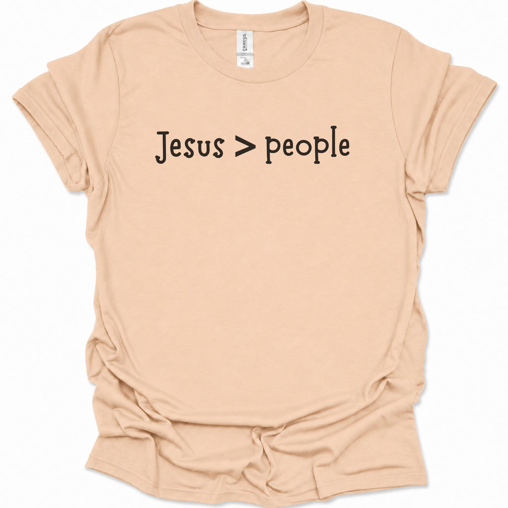 A light natural-colored short-sleeve t-shirt with the text 'Jesus > people' printed in black across the chest, displayed on a clean white background.