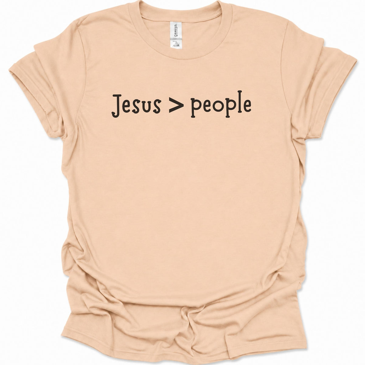 A light natural-colored short-sleeve t-shirt with the text 'Jesus > people' printed in black across the chest, displayed on a clean white background.