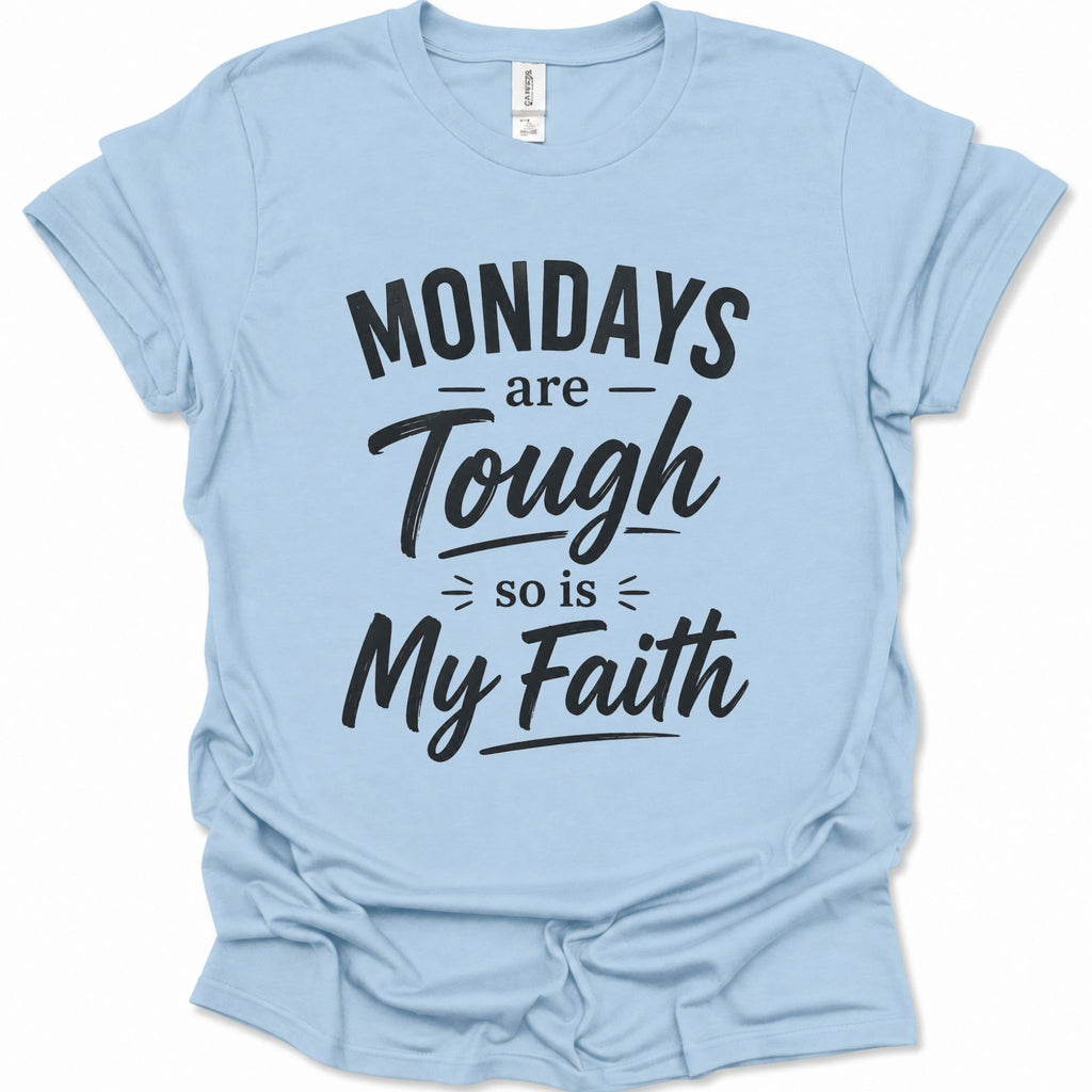 A light blue short-sleeve t-shirt with a black graphic text print reading 'MONDAYS are Tough so is My Faith' on a clean white background.