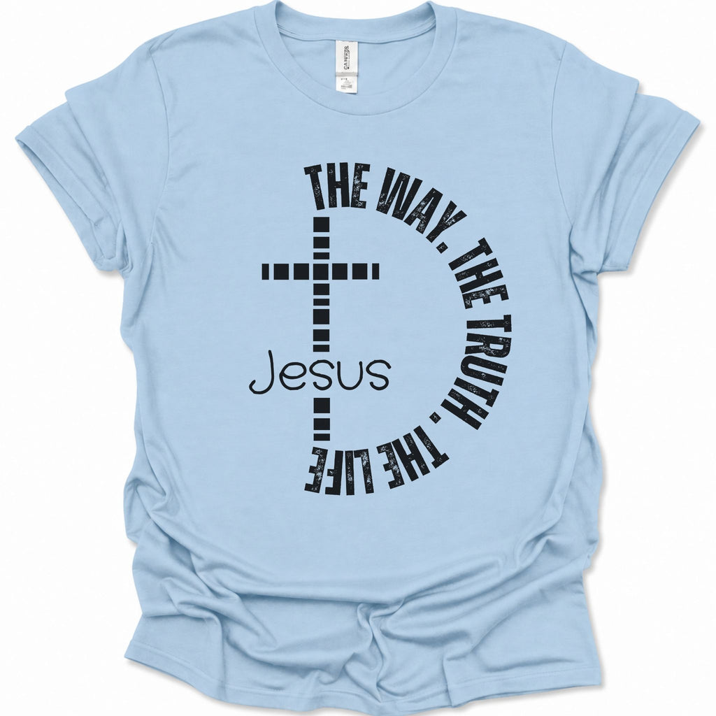 A light blue short-sleeve t-shirt with a black graphic print on the front featuring a cross, the word 'Jesus', and the phrase 'THE WAY, THE TRUTH, THE LIFE' curved around it.