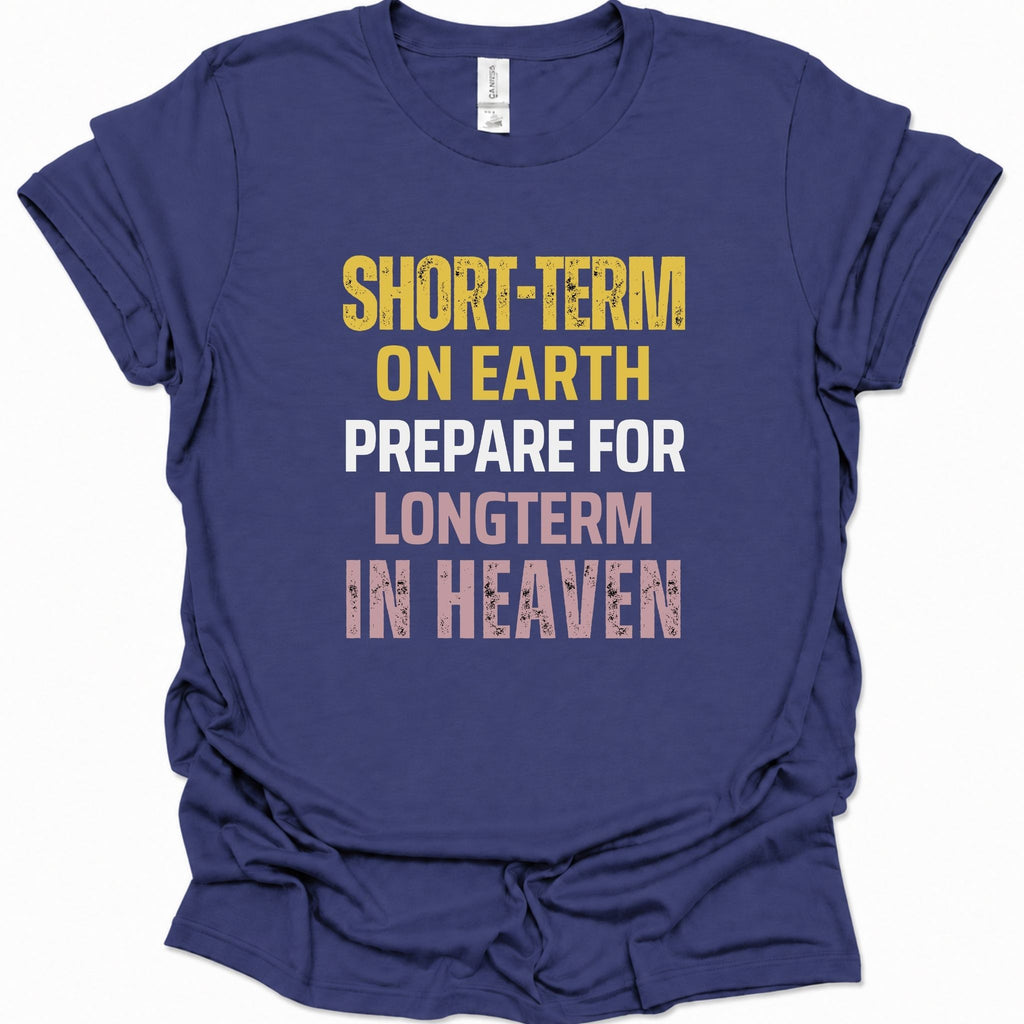 A purple blue short-sleeve t-shirt with a distressed typographic graphic on the front reading 'SHORT-TERM ON EARTH PREPARE FOR LONGTERM IN HEAVEN' in yellow, white, and pink lettering.