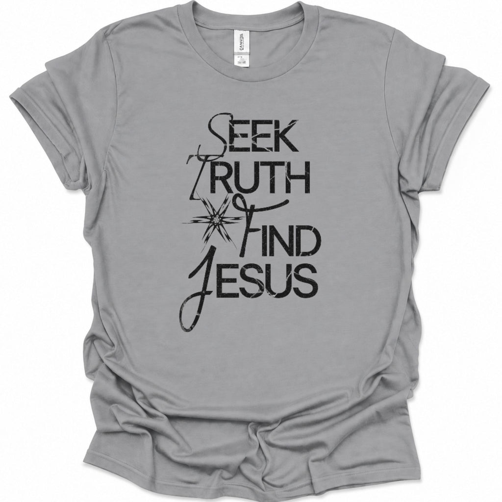 A sport gray short-sleeve t-shirt with a black graphic print on the front reading 'SEEK TRUTH FIND JESUS' with a starburst design, shown on a plain white background.