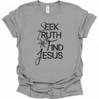 A sport gray short-sleeve t-shirt with a black graphic print on the front reading 'SEEK TRUTH FIND JESUS' with a starburst design, shown on a plain white background.