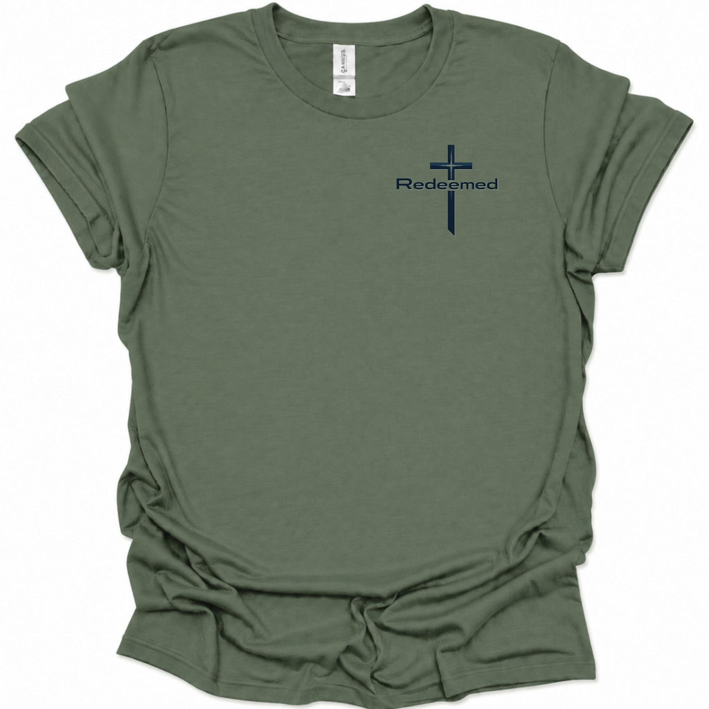 A military green short-sleeve t-shirt with a small navy blue cross and the word 'Redeemed' printed on the left chest, displayed on a clean white background.