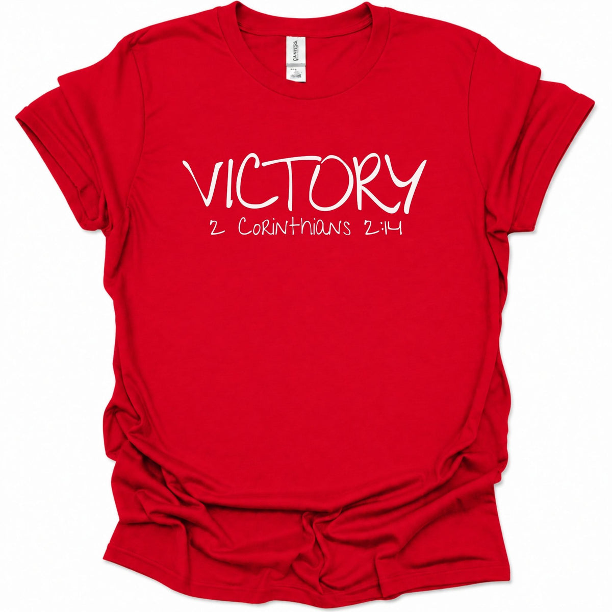 A bright red short-sleeve t-shirt with 'VICTORY 2 CORINTHIANS 2:14' printed in white across the chest, displayed on a clean white background.