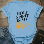 Light blue t-shirt with 'Holy Spirit is my Helper' text on a wooden surface with jeans and a Bible. Holy Spirit is My Helper Christian T-Shirt John 14:26 faith apparel Faith Forward