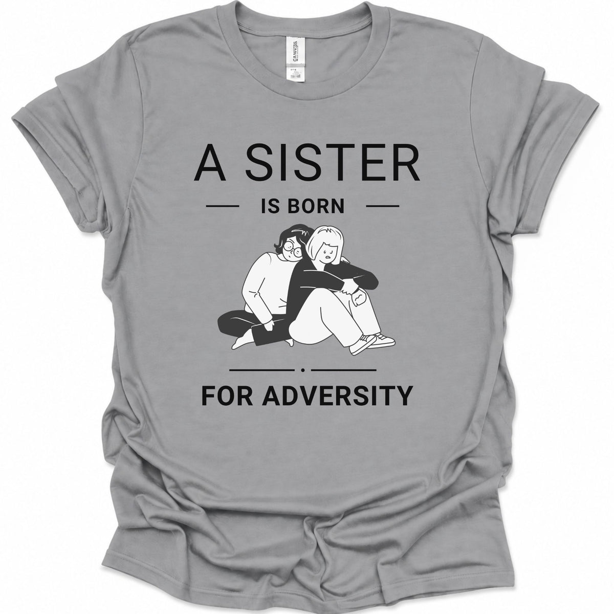 A sport gray short-sleeve t-shirt with a black graphic print that reads 'A SISTER IS BORN FOR ADVERSITY' surrounding an illustration of two people hugging. The Gildan brand tag is visible inside the collar.