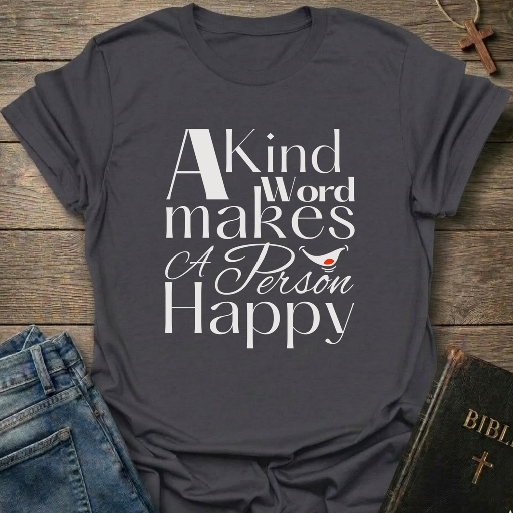 Gray t-shirt with 'A Kind Word makes A Person Happy' Proverbs 12:25 text with a smile. Christian elegant typography faith apparel conversation starter
on a wooden surface with jeans and a Bible.