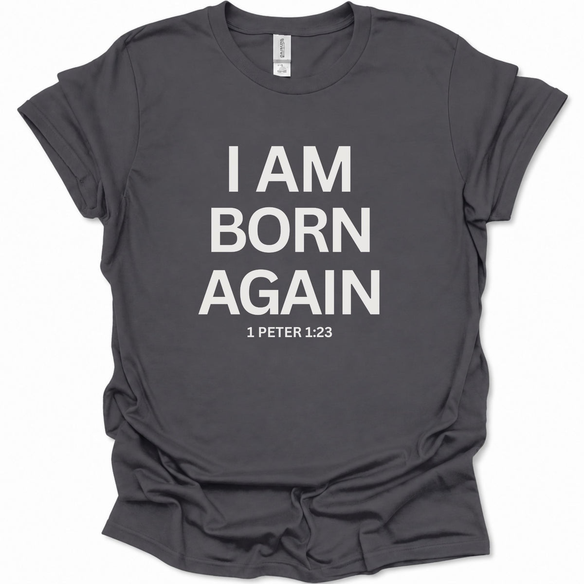 A dark heather gray short-sleeve t-shirt with bold white text reading 'I AM BORN AGAIN' and '1 PETER 1:23' printed on the front, shown on a plain white background.