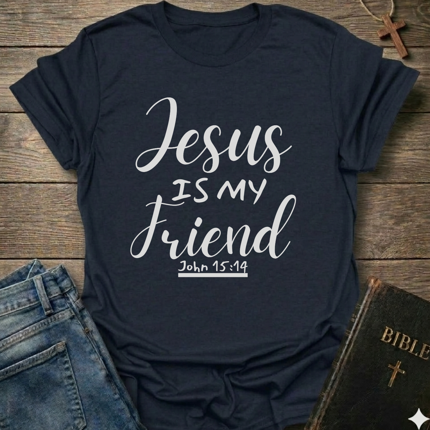 Navy blue t-shirt with 'Jesus is my friend' text on a wooden surface with jeans and a Bible. Jesus is My Friend Christian T-Shirt John 15:14 bold faith apparel Faith Forward