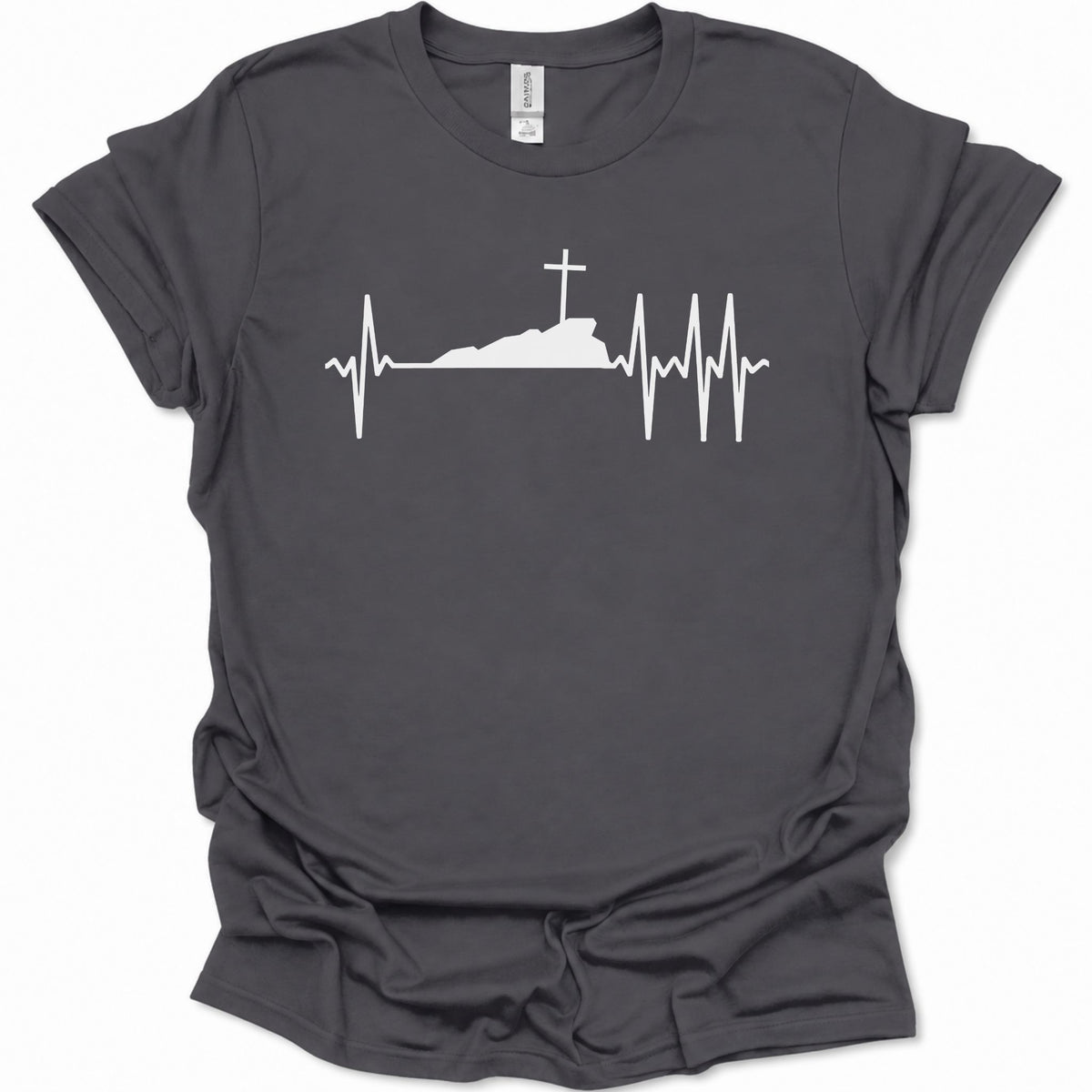 A dark heather gray short-sleeve t-shirt with a white graphic print of a cross on top of a hill, integrated into an EKG heartbeat line, shown on a plain white background.