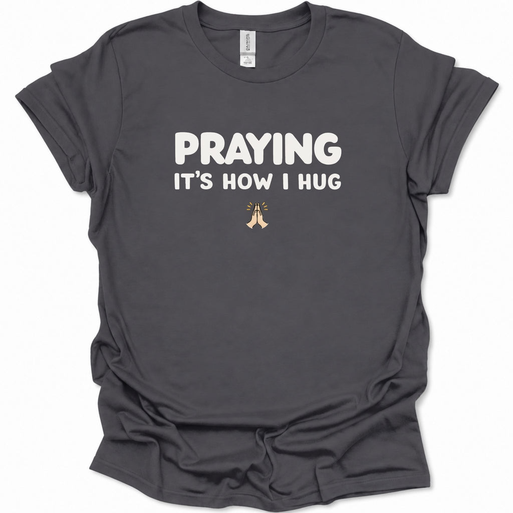 A dark heather gray short-sleeve t-shirt with a graphic on the chest showing four square icons: a Christian cross, an anchor, a heart, and a dove, all in a muted blue-gray color.