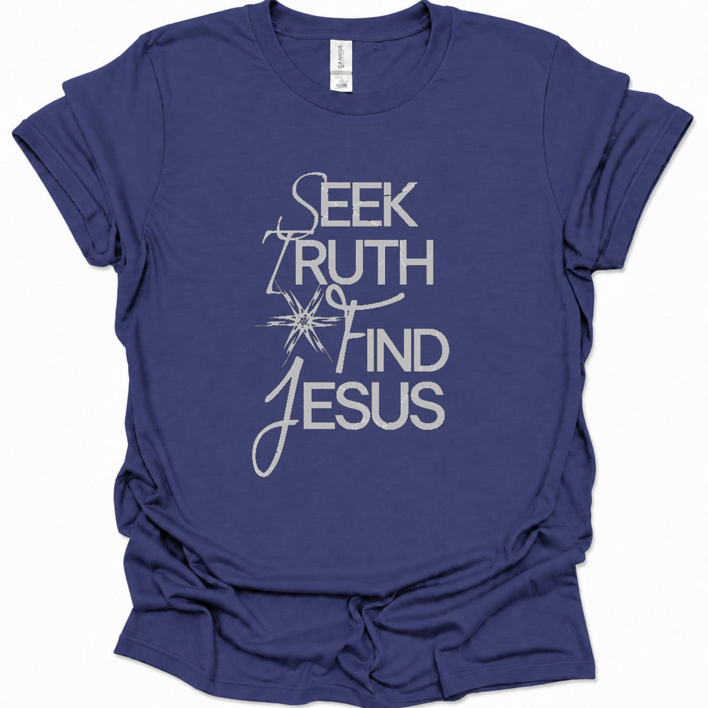 A purple blue short-sleeve t-shirt with a white graphic text print reading 'SEEK TRUTH AND FIND JESUS' on the front, displayed against a clean white background.