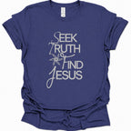 A purple blue short-sleeve t-shirt with a white graphic text print reading 'SEEK TRUTH AND FIND JESUS' on the front, displayed against a clean white background.