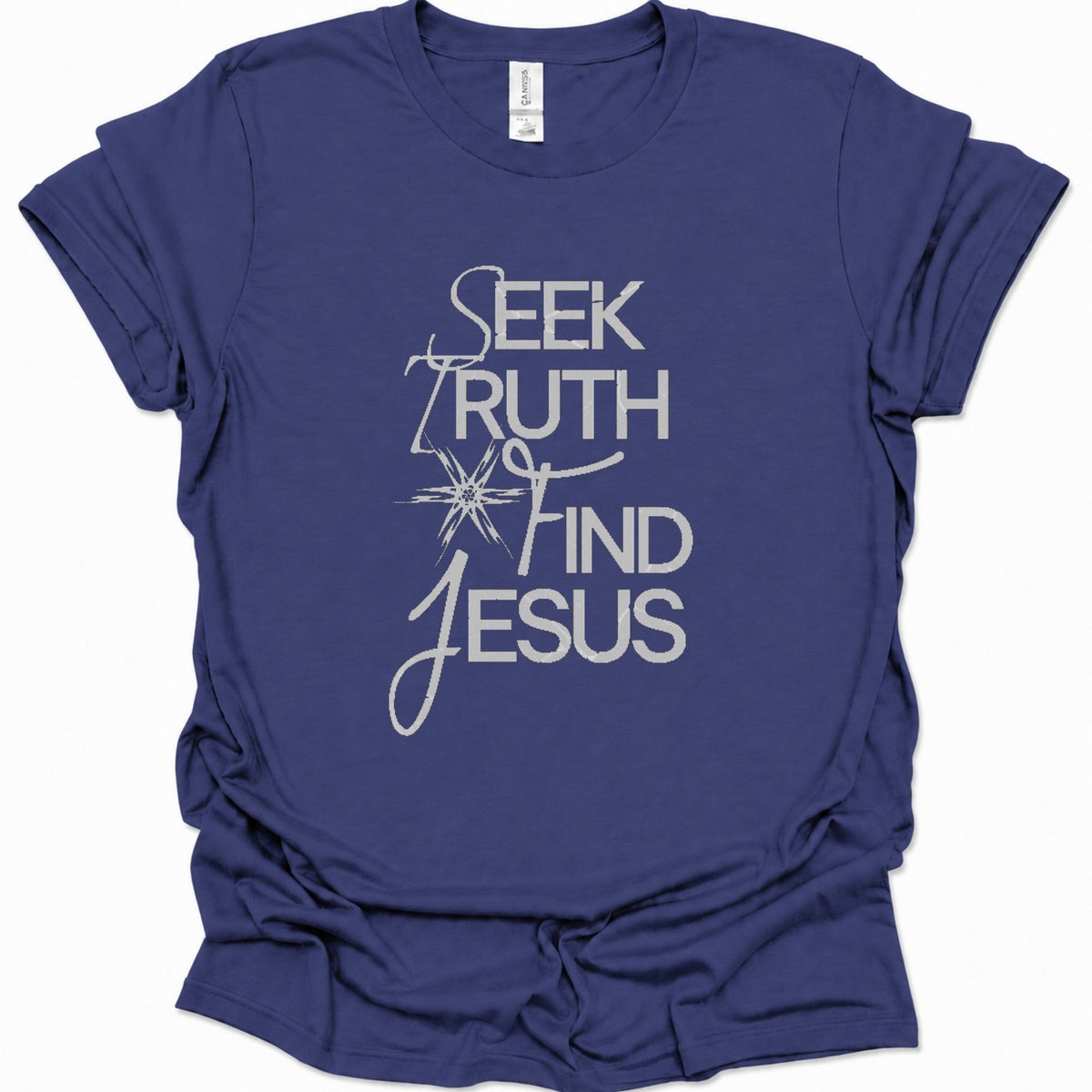 A purple blue short-sleeve t-shirt with a white graphic text print reading 'SEEK TRUTH AND FIND JESUS' on the front, displayed against a clean white background.