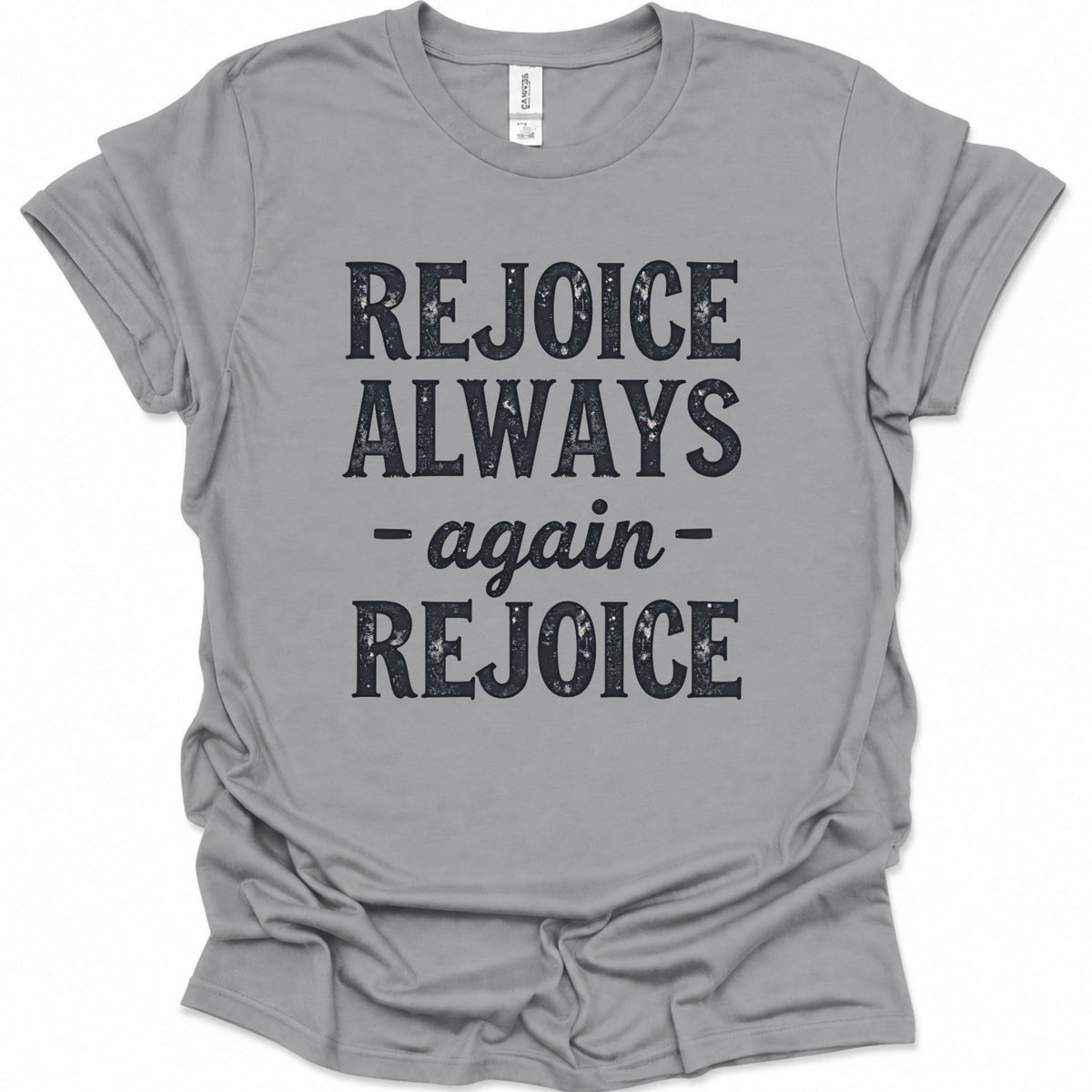 A sport gray short-sleeve t-shirt with a distressed black graphic print that reads 'REJOICE ALWAYS - again - REJOICE' on the front, displayed flat against a white background.