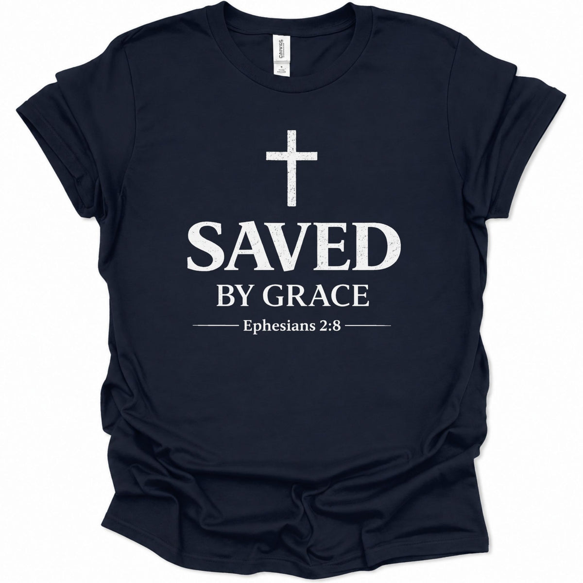 A navy blue short-sleeve t-shirt with a white graphic print on the front featuring a cross, the text 'SAVED BY GRACE', and 'Ephesians 2:8'.
