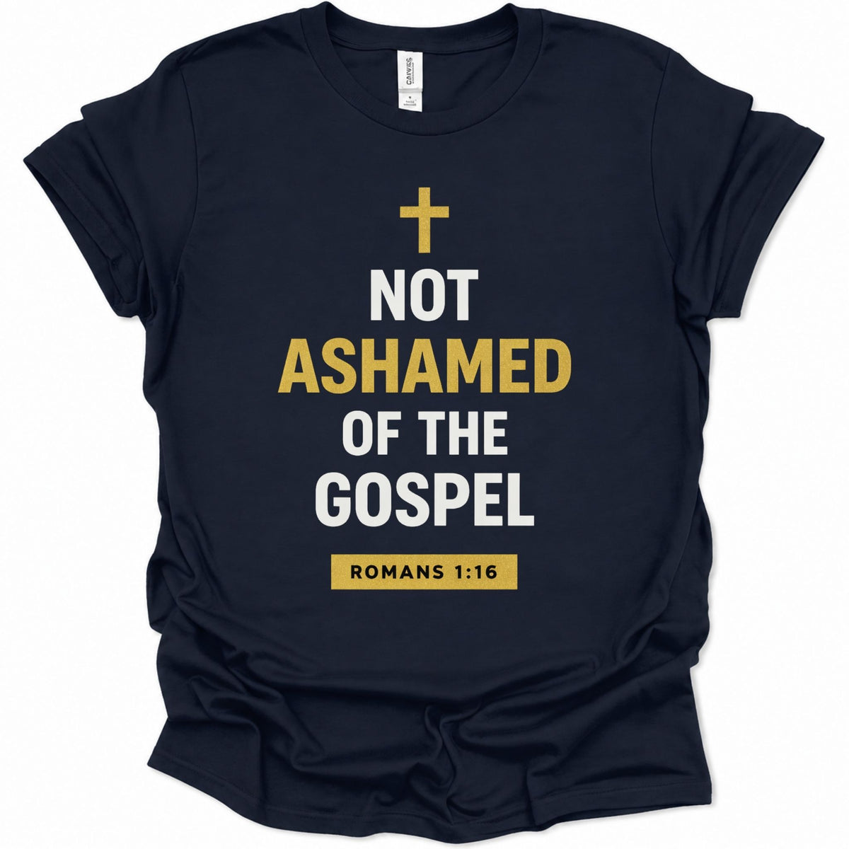 A navy blue short-sleeve t-shirt with a graphic print on the front. The print features a gold cross, the text 'NOT ASHAMED OF THE GOSPEL' in white and gold, and a gold box containing 'ROMANS 1:16' at the bottom.