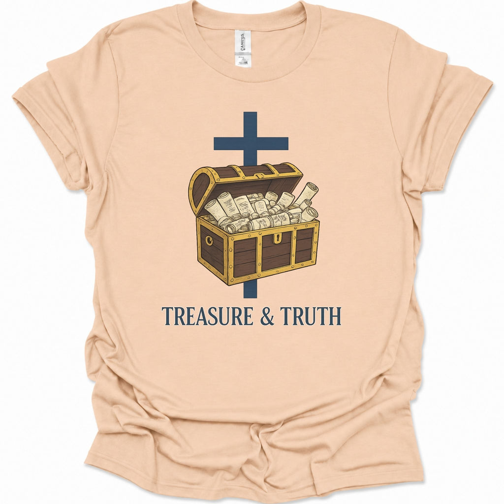 A light natural-colored short-sleeve t-shirt with a graphic of an open treasure chest filled with cash, a dark blue cross, and the text 'TREASURE & TRUTH' printed below.