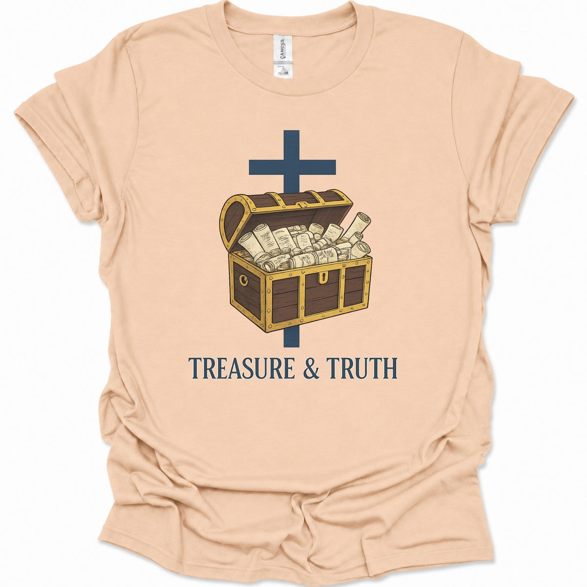 A light natural-colored short-sleeve t-shirt with a graphic of an open treasure chest filled with cash, a dark blue cross, and the text 'TREASURE & TRUTH' printed below.