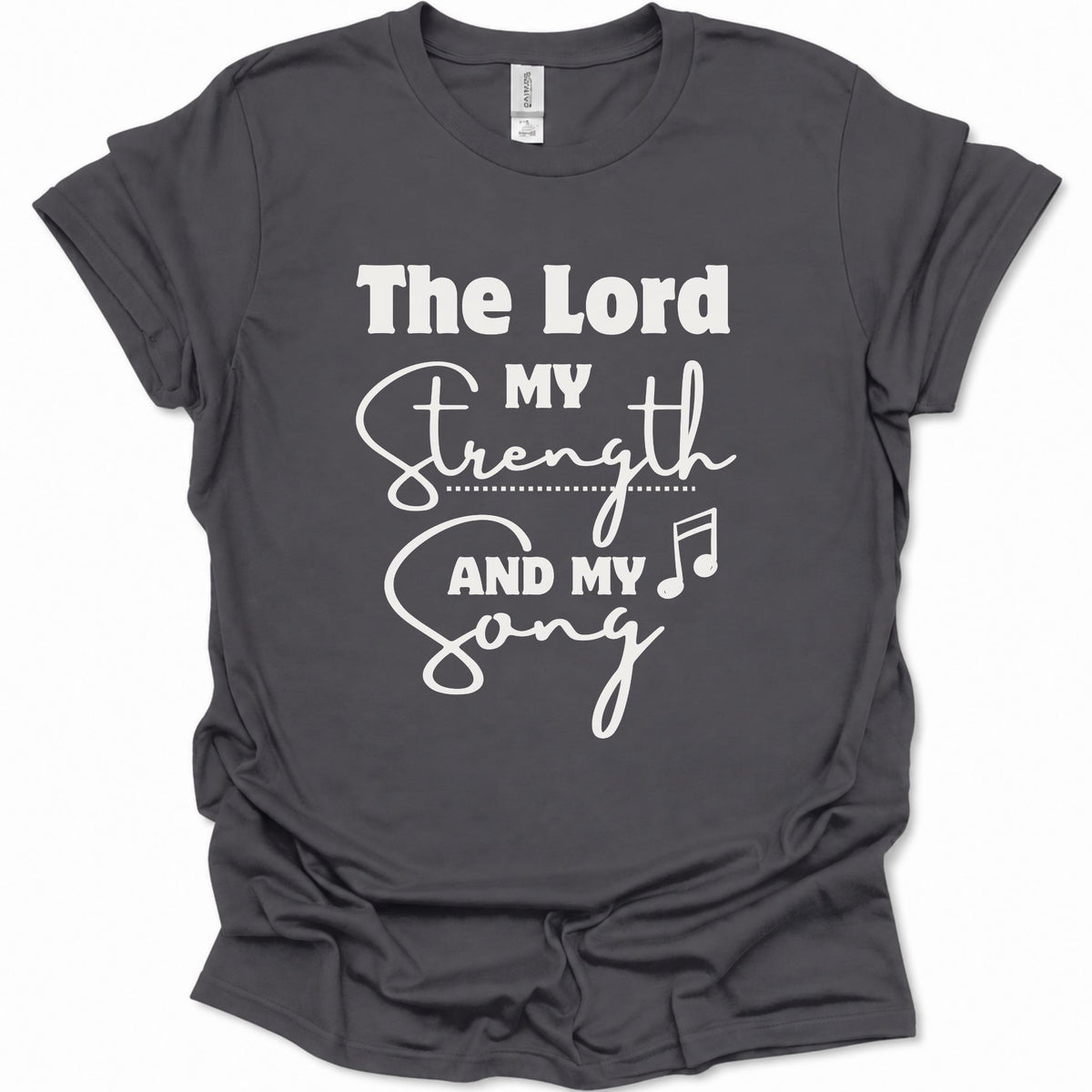 A dark heather gray short-sleeve t-shirt with a white graphic print that reads 'The Lord My Strength And My Song' with a music note, displayed on a clean white background.