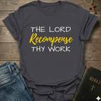 Gray t-shirt with "The Lord Recompense Thy Work" Ruth 2:12 black gold text faith apparel Faith Forward on a wooden surface with jeans and a Bible.