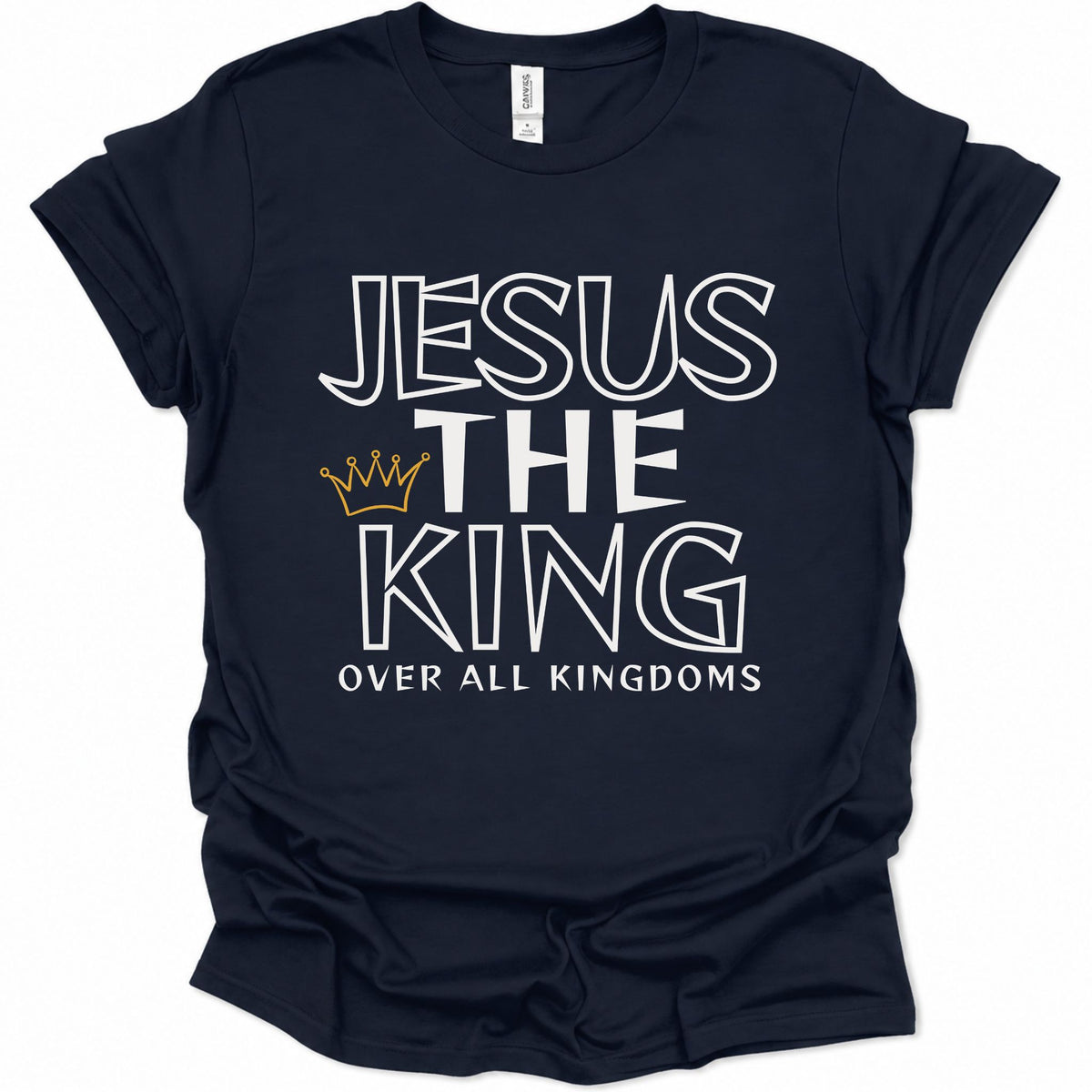 A navy blue short-sleeve t-shirt with a graphic print reading 'JESUS THE KING OVER ALL KINGDOMS' in white outlined lettering, accented by a small gold crown icon, shown on a plain white background.