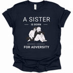 A navy blue short-sleeve t-shirt with a white graphic print that reads 'A SISTER IS BORN FOR ADVERTITY' surrounding an illustration of a sister and brother hugging. The shirt is shown flat against a plain white background.