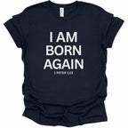 A navy blue short-sleeve t-shirt with bold white text on the front reading 'I AM BORN AGAIN' and '1 PETER 1:23' underneath, shown on a plain white background.