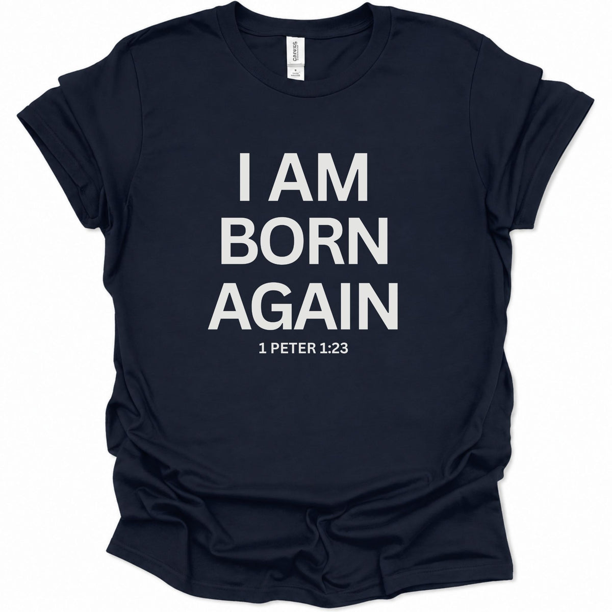 A navy blue short-sleeve t-shirt with bold white text on the front reading 'I AM BORN AGAIN' and '1 PETER 1:23' underneath, shown on a plain white background.