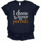 A navy blue short-sleeve t-shirt with a graphic text print reading 'I choose to honor my parents' in white and metallic gold lettering, displayed on a clean white background.
