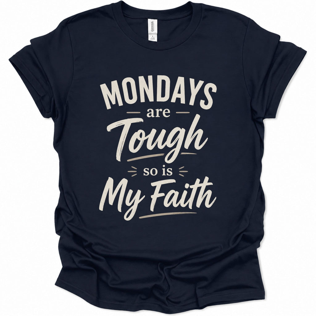 A navy blue short-sleeve t-shirt with a distressed white graphic text that reads 'MONDAYS are Tough so is My Faith' on a solid white background.