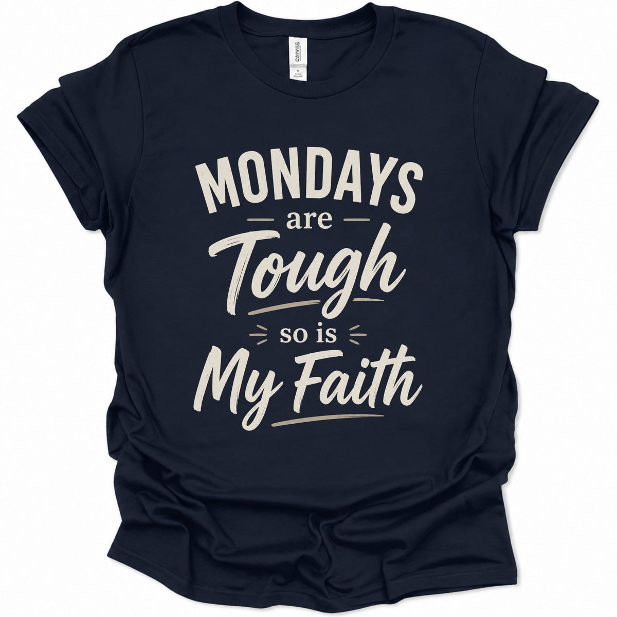 A navy blue short-sleeve t-shirt with a distressed white graphic text that reads 'MONDAYS are Tough so is My Faith' on a solid white background.