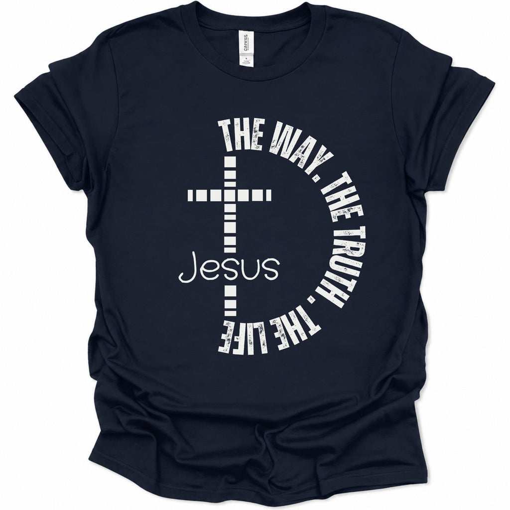 A navy blue short-sleeve t-shirt with a white graphic print on the front featuring a cross, the word 'Jesus', and the phrase 'THE WAY, THE TRUTH, THE LIFE' arranged in a circle.