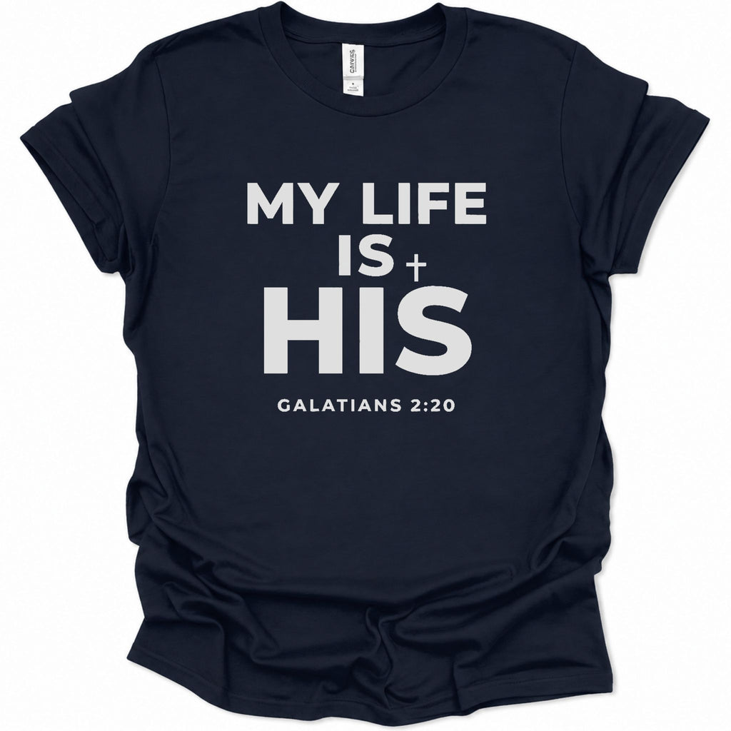 A navy blue short-sleeve t-shirt with white printed text reading 'MY LIFE IS HIS' and 'GALATIANS 2:20' on the front, shown against a plain white background.